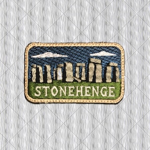 May include: A rectangular embroidered patch featuring a depiction of Stonehenge with tan stone pillars against a dark blue sky with white clouds, set above a green grassy base. The word STONEHENGE is stitched in white capital letters at the bottom.