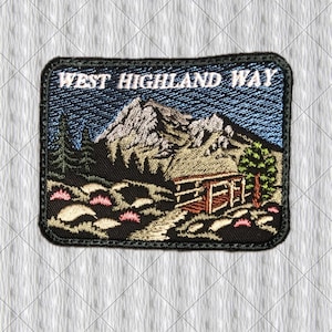 May include: Embroidered patch featuring a mountain landscape with a cabin and the text "WEST HIGHLAND WAY". The patch has a black border and depicts a mountain range, trees, and a cabin in shades of brown, green, and blue.