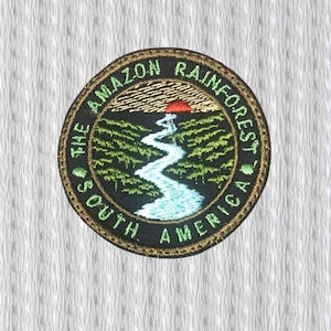 May include: Embroidered patch featuring a circular design with the text "THE AMAZON RAINFOREST SOUTH AMERICA". The patch depicts a river winding through a green landscape under a red sun. The border is gold.