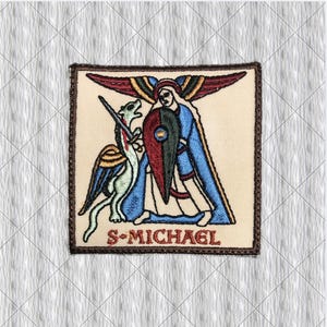 May include: A square embroidered patch on a cream background featuring a figure with wings, a blue robe, and a shield, standing over a dragon-like creature with a sword. The text S-MICHAEL is embroidered in red at the bottom of the patch.
