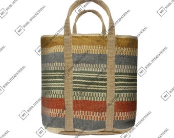 May include: A woven tote bag with a striped pattern in shades of blue, green, and orange. The bag has two thick, woven handles.
