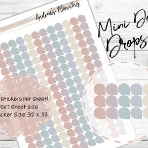 May include: A sheet of 192 mini dew drop stickers in pastel pink, beige, light blue, and gray. The stickers are arranged in rows and columns on a white background. The text "Mini Dew Drops" is written in black cursive at the top of the sheet. The text "192 Stickers per sheet! 5x7 Sheet size Sticker Size .32 x .32" is written in pink on a white background with a pink border.