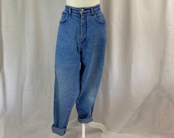 May include: A pair of light blue denim jeans with a high waist and a relaxed fit. The jeans have a button fly and are cuffed at the bottom.