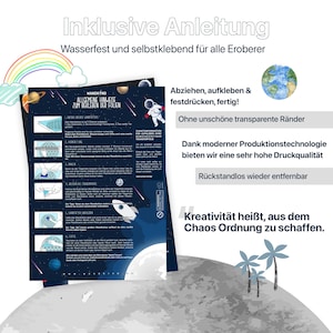 May include: A colorful instruction sheet with a rainbow and a globe on the top. The sheet has instructions for applying a sticker, with illustrations of each step. The text on the sheet reads "Inklusive Anleitung" and "Wasserfest und selbstklebend f&uuml;r alle Eroberer".