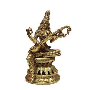 Exotic India Goddess Saraswati Playing on Veena - Solid Brass, Symbol Of Devotion And Craftsmanship, Handmade Brass Statue, Made In India