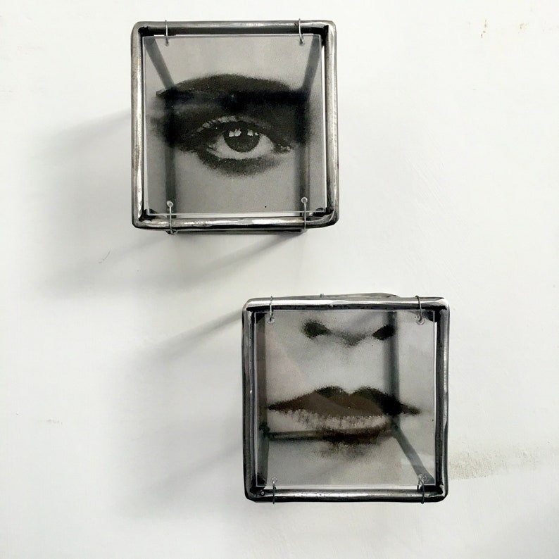 Two piece of 3d wall art, eye and lips, in Pop art style. Black and white photo  transparent print in cubic sculptures 10 cm cubic each one. Handmade from steel bar by Artandshadow