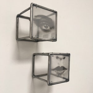 Two piece of 3d wall art, eye and lips, in Pop art style. Diptych wall sculpture handmade from steel bar by Artandshadow