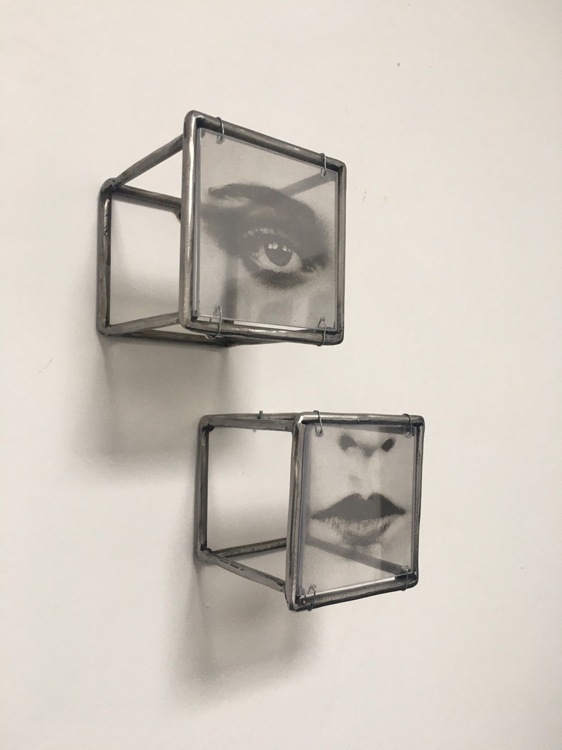 Two piece of 3d wall art, eye and lips, in Pop art style. Diptych wall sculpture handmade from steel bar by Artandshadow