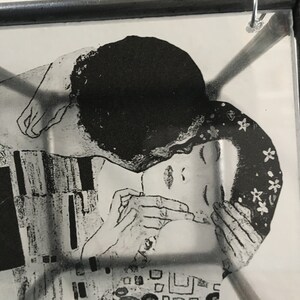 Detail of the painting The Kiss painting by Gustave Klimt printed on transparent paper and framed in a cubic metal sculpture. Handmade by Artandshadow