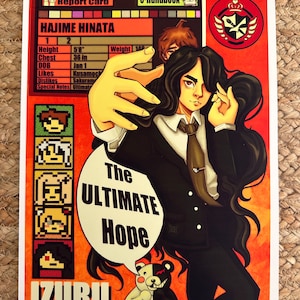 May include: A red and black illustration of a character from the video game Danganronpa. The character is a young man with black hair and red eyes. He is wearing a black suit and tie. The text "The Ultimate Hope" is written in a speech bubble above his head. The text "IZURU" is written in large letters at the bottom of the image.