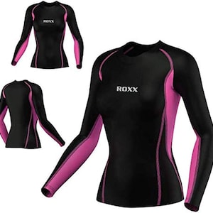 May include: Black long-sleeve shirt with pink accents and the word "ROXX" printed on the front.