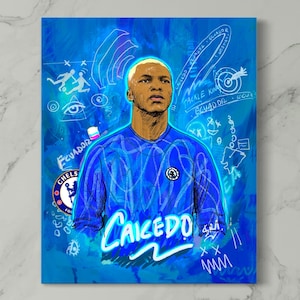 May include: A vibrant blue portrait of a soccer player, featuring the name "Caicedo" in a stylized font. The artwork includes the Chelsea FC logo and the word "Ecuador" with artistic elements in white. The player is wearing a blue jersey.