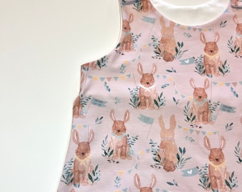 Baby girls pink easter bunny rabbit print romper, leggings and romper dress options with matching bib, turban and headband options.