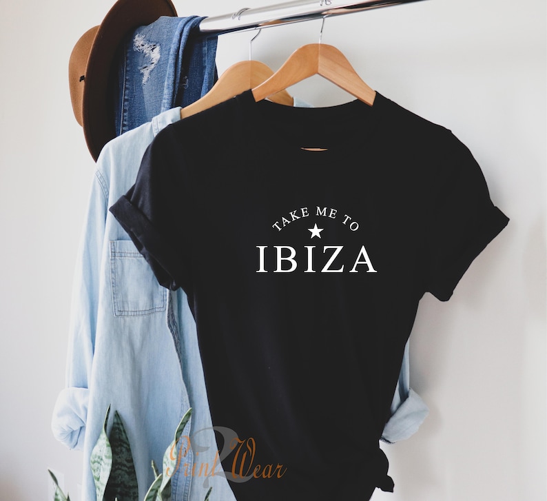 May include: Black t-shirt with white text that reads "Take me to Ibiza" with a white star above the word Ibiza.