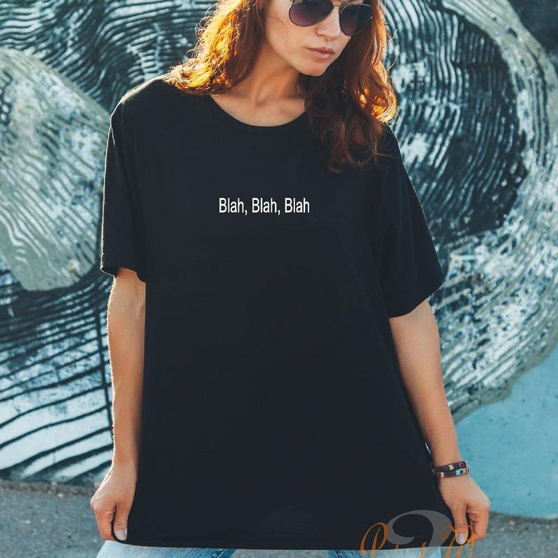 May include: A black t-shirt with the text "Blah, Blah, Blah" printed in white on the front.
