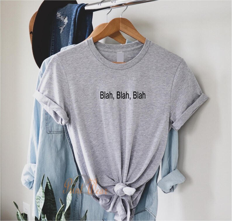 May include: A gray t-shirt with the text "Blah, Blah, Blah" printed on the front.