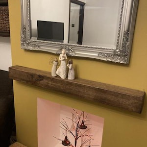 a mirror with a picture of a bird on it