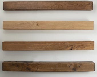May include: Six wooden planks of varying shades of brown, arranged horizontally on a white background. The planks are all the same size and shape, and they are all made of the same type of wood.