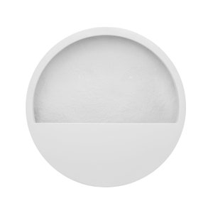 May include: White circular wall planter with a shelf on the bottom. The planter has a smooth, slightly textured surface.