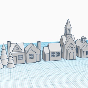 May include: A 3D printed model of a small town with a church, houses, and trees. The model is made of white plastic and has a light gray color.
