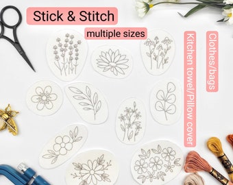 Könnte beinhalten: Eine Sammlung gestickter Blumendesigns in verschiedenen Formen und Größen, ideal für DIY-Projekte. Die Designs umfassen Lavendel, eine Lotusblume, Gänseblümchen und andere botanische Elemente. Der Text "Stick & Stitch" und "multiple sizes" ist sichtbar.