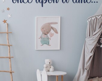 May include: A light blue children's room with a wooden ladder, a white bunny rabbit picture, a white bunny rabbit chair, a white table, a teddy bear, a brown bear holding a white balloon, and the words "once upon a time..." on the wall.