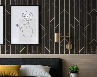 May include: A black bed with a white headboard and a yellow pillow. The bed has a black and white blanket on it. There is a small plant in a white pot on a white nightstand next to the bed. The wall behind the bed has a black and gold geometric wallpaper.