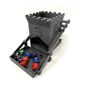 May include: A gray 3D printed tower-shaped dice rolling tower with a drawbridge. The tower has a small window and the drawbridge is open, revealing a tray with colorful dice.