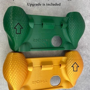 May include: Two 3D-printed controller grips in green and yellow, featuring a hexagonal texture on the handles and the word THOR embossed on the front. Text on the image reads: Discounted subpar option with some production errors. Stylus and Trigger Upgrade is included. May include previous version that don't fit Nintendo Switch Styluses.