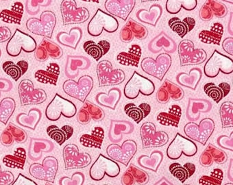 May include: A repeating pattern of hearts in shades of pink, red, and white. The hearts feature various designs, including floral patterns, polka dots, and solid colors, set against a light pink background. This design is suitable for Valentine's Day or romantic themes.