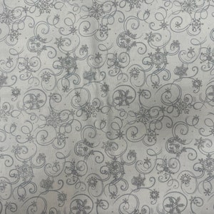Christmas Snowflake on a snow background/metallic silver by Fabric Tradition, clothing ,crafts and quilting ,B.T.Y. 3/4,1/2,1/4,fat quarter