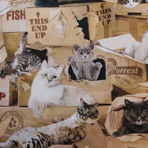 May include: A brown and tan fabric with a repeating pattern of cats in cardboard boxes. The boxes have text on them such as "Fresh Fish", "This End Up", and "Purrest Cat Food".