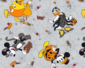 May include: Halloween-themed fabric with cartoon characters including Mickey Mouse, Donald Duck, and Minnie Mouse. The characters are in Halloween costumes, surrounded by sweets, spiderwebs, and pumpkins. The background is a light grey colour.