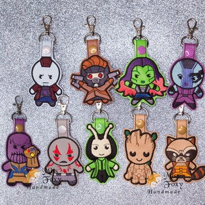 Superhero Chibi Style Movie Characters Galaxy Inspired Vinyl Keychain | Key Fob | Backpack Charm | Zipper Pull | Luggage Tag | Embroidered