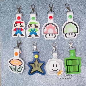 Handmade 8-Bit Videogame Mushroom Star Flower inspired Vinyl Keychain | Key Fob | Backpack Charm | Zipper Pull | Luggage Tag | Embroidered