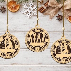 May include: Three circular wooden ornaments featuring laser-cut designs. Two ornaments depict a utility worker in a bucket truck, while one shows various electrical tools. The borders are engraved with the words: COURAGEOUS, TEAM-ORIENTED, RELIABLE, ADAPTABLE, RESILIENT, DEDICATED, DISCIPLINED, and OBSERVANT.