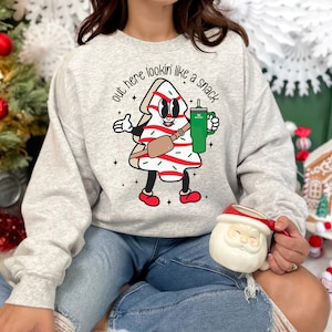 Out here lookin like a snack little Debbie Christmas tree Stanley Crewneck