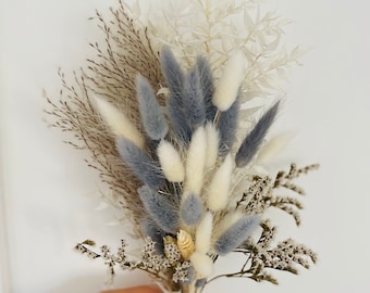 A small, delicate grey and bleached white small dried flower bouquet/arrangement