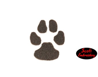 May include: An embroidered paw print design in brown. The paw print is a simple design with four toes and a pad.