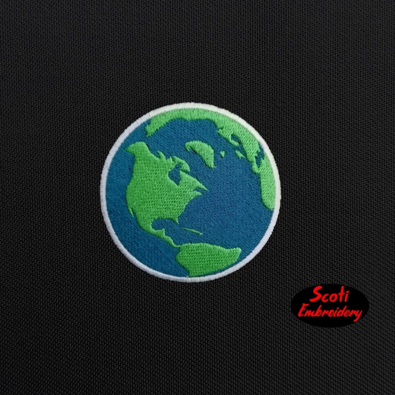 May include: Embroidered patch depicting the Earth. The continents are rendered in green, set against a blue ocean, and framed by a white border. The patch is circular and includes the text "Scoti Embroidery".