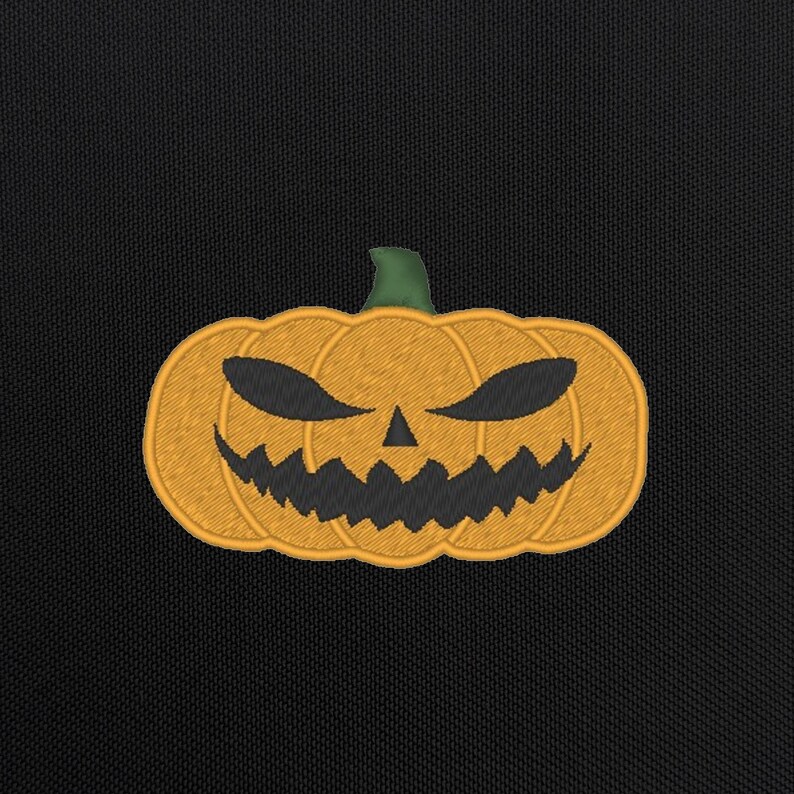 May include: A black background with an orange embroidered jack-o'-lantern with a scary face.