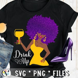 May include: Black t-shirt with a purple glitter afro and a woman holding a glass of wine. The text "Drink Up" is written in white with a heart design. The design is on a black t-shirt.