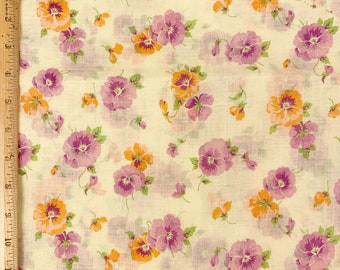 May include: A white fabric with a repeating pattern of purple and yellow pansies. The pansies are scattered randomly across the fabric.