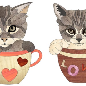 Puede incluir: Dos gatitos grises y blancos están sentados en tazas de té. La taza de té de la izquierda tiene un borde rojo y corazones en el lado. La taza de té de la derecha tiene un borde marrón y la palabra "LOVE" en el lado.