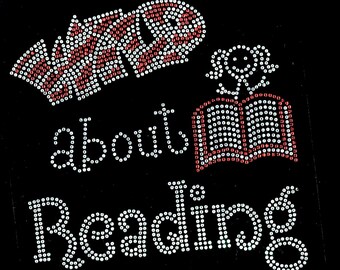 May include: A white and red rhinestone design that says "Wild about Reading" with a small red book and a smiling face.