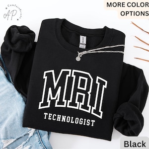May include: Black sweatshirt with white text that reads "MRI Technologist" in a collegiate font.