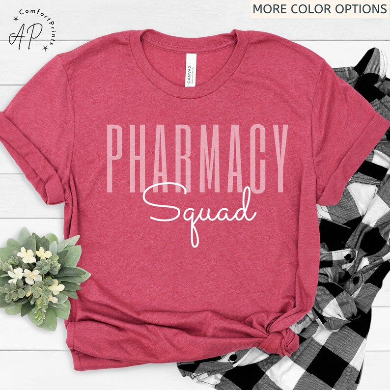 May include: Red t-shirt with white text that reads "Pharmacy Squad".