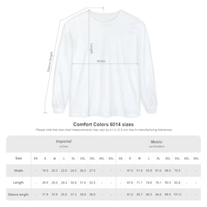 May include: White long-sleeve shirt with size chart. The chart shows measurements in inches and centimeters for width, length, and sleeve length. The shirt's width ranges from 18.5 to 27.5 inches, and the length is between 26.6 and 32.5 inches.
