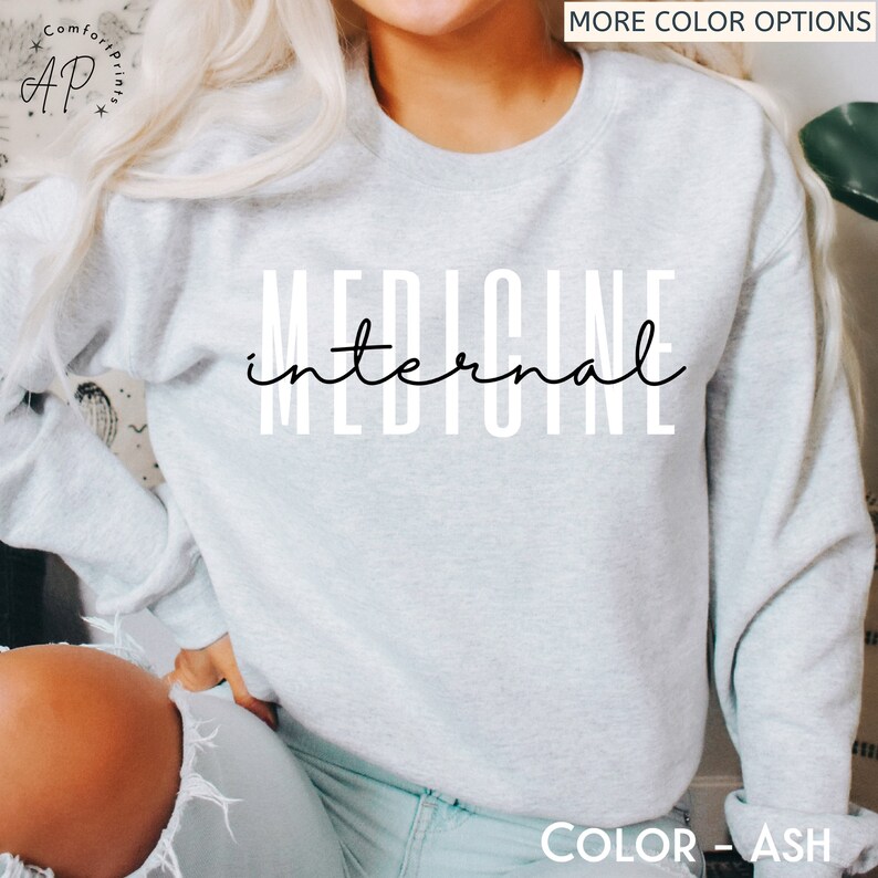 May include: A light gray sweatshirt with the text "internal medicine" printed in black.