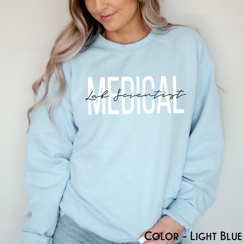 May include: Light blue sweatshirt with the text "MEDICAL Lab Scientist" in white lettering.